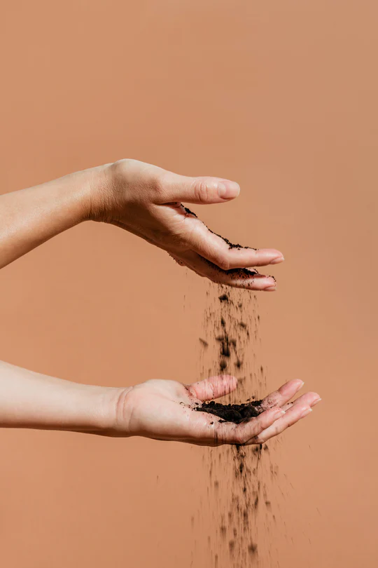 Hands with soil
